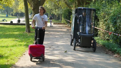 Digital X 2024: XBoard with an attachment and a bean bag, alongside a cargo bike in a park