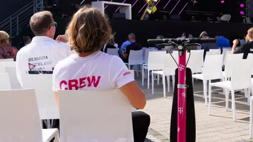 Digital X 2024: Folded XBoard with Telekom branding and a spectator at the Digital X event